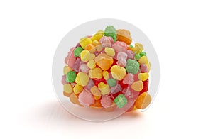 Sweet and Tangy Candy with Small Candies on the Outside of a Chewy Center Isolated on a White Background