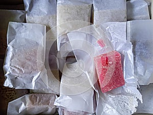 Sweet taste of red dodol cake in food plastic packaging photo
