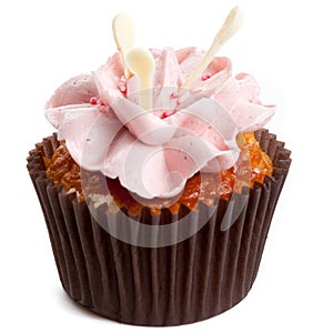 Sweet tasty homemade cupcake with strawberry cream isolated