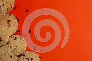 Sweet and tasty pistachio cookies on orange background. Top view.