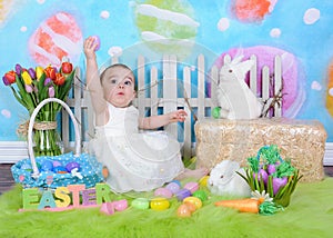 Sweet toddler girl in easter scene