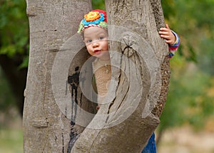 Sweet toddler girl hiding