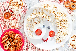 Sweet treats for children - popcorn pretzel bagel cookies. Face