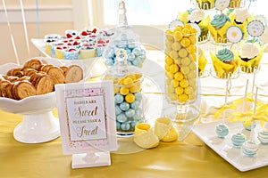 Sweet treats and sign at a Baby Shower