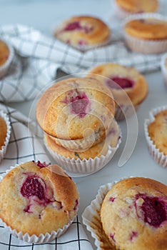 Sweet vanilla raspberry muffins on a table