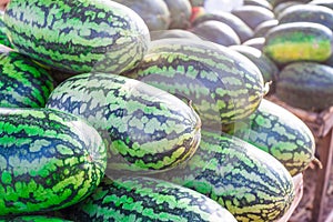 Sweet watermelon, a large number of large green organic crops on the farmers market in Thailand, Asia. Fruit for weight loss and