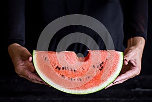 Sweet watermelon in woman hand