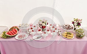 Sweet Wedding Table with Cakes and Strawberry on Top, Fruits and Flowers.