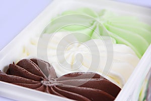 Sweet white cream, green pistachio, brown chocolate ice cream