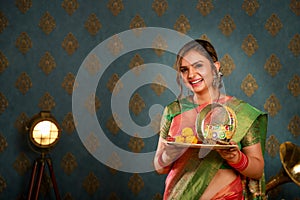 Sweet Wife In Saree Holding Puja Plate In Hand During Karwa Chauth Festival