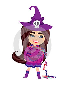 sweet witch standing with pumpkin full of candy
