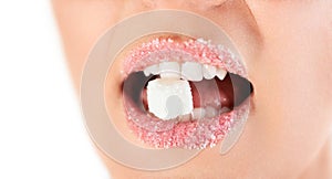 Sweet woman lips with granulated sugar