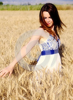 Sweet woman on wheat