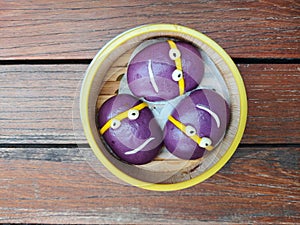 sweet yam taro bun on bamboo steamer.