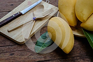 Sweet yellow mango fruit on wood table , ready to eat for healt