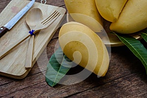 Sweet yellow mango fruit on wood table , ready to eat for healthy , fruit on summer