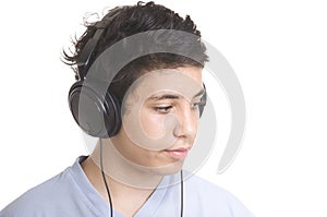 sweet young boy listening to music on headphones