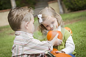 Sweet Young Brother and Sister At the Pumpkin Patch