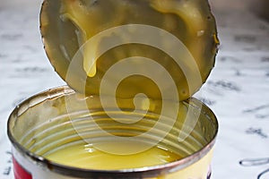 Sweetened condensed milk on the lid of the can