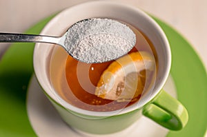 Sweetener in a cup of tea