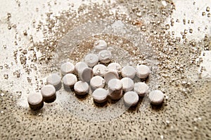 Sweetener tablets lying on a light background