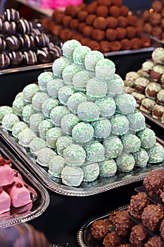 Sweetness balls build as a pyramid for sle in a pastry shop