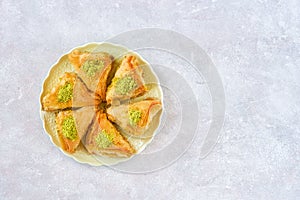 Sweets arabic dessert baklava, , kunafa, kadayif with pistachio and cheese . Top view, copy space