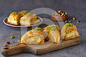 Sweets arabic dessert kunefe, kunafa, kadayif with pistachio and cheese