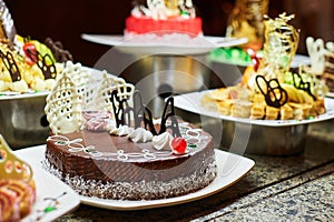 Sweets on banquet table - picture taken during catering event. Rows of tasty looking desserts in beautiful arrangements