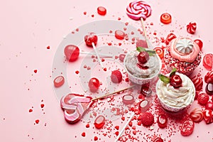 Sweets. Candy And Cupcakes On Pink Background