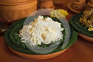 Sweets Coconut Ball Thai traditional dessert, Kanom Tom named in Thai, on banana leaf dish photo