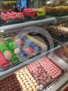 Sweets and confectionary goods in a display window of a bakery in Sao Paulo photo