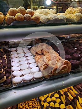 Sweets and confectionary goods in a display window of a bakery in Sao Paulo photo