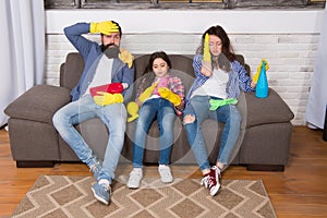 Swept away. Maid service. Best cleaning service. Family clean house. Happy family hold cleaning products. Mother, father
