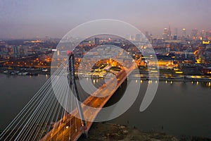 Swietokrzyski bridge over the Vistula river at night. Warsaw