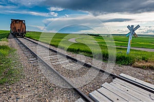 Swift Current, SK/Canada- July 1, 2019: End of line of train cars at railway crossing in Saskatchewan, Canada