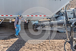 Swift Current, SK/Canada- May 15, 2020:  Farmer loading fertilizer from the Super-B into Bourgault auger for seeding in Saskat