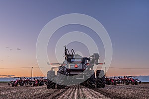 Swift Current, SK/Canada- May 10, 2019: Tractor and Bourgault air drill seeding equipment in the field