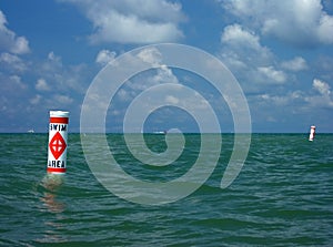 Swim area buoy against expanse of water