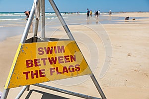 Swim between the flags surf lifesaving sign