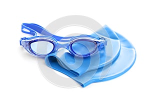 Swim goggles and cap isolated. Beach objects