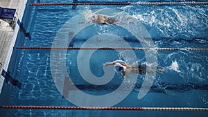 Swim Race: Two Professional Swimmers Swim in Swimming Pool, Stronger and Faster Wins. Athletes