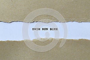 swim run bike on white paper