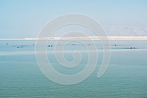 Swimers in Dead sea, Ein Bokek, Israel.