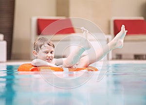 Swiming boy in pool