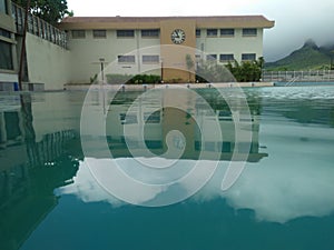 Swiming pool with building shadow photo