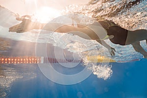 Swimmer in back crawl style underwater