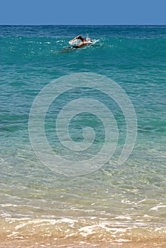 Swimmer in a bay of St. Barth, Caribbean