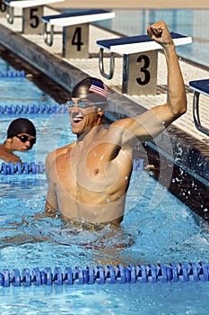 Swimmer Celebrating Victory In Pool