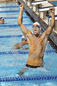 Swimmer Celebrating Victory In Pool